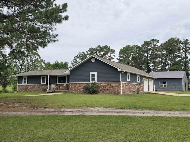 2373 W Rd, Mount Pleasant, AR 72561 - ranch-style house with an attached garage, a front lawn, concrete driveway, brick siding, and a porch