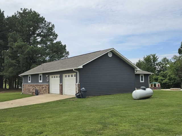 2373 W Rd, Mount Pleasant, AR 72561 - view of home's exterior featuring a garage, a lawn, and driveway