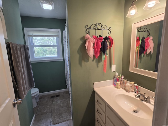 2373 W Rd, Mount Pleasant, AR 72561 - full bathroom with toilet, vanity, and baseboards