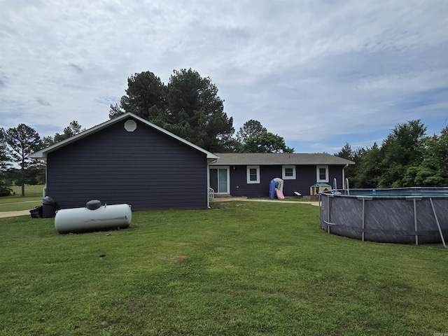 2373 W Rd, Mount Pleasant, AR 72561 - rear view of house with a yard and an outdoor pool