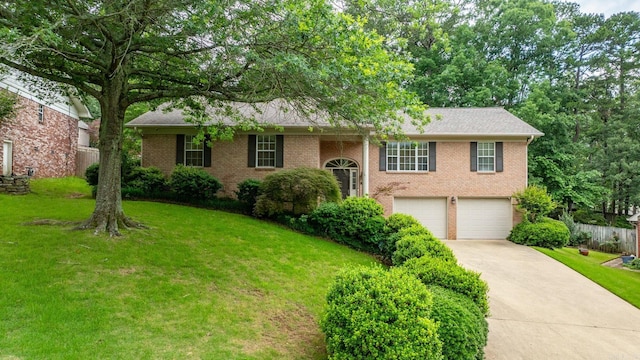 14 Cambay Ct, Little Rock, AR 72211 - view of front of home with brick siding, a garage, and concrete driveway