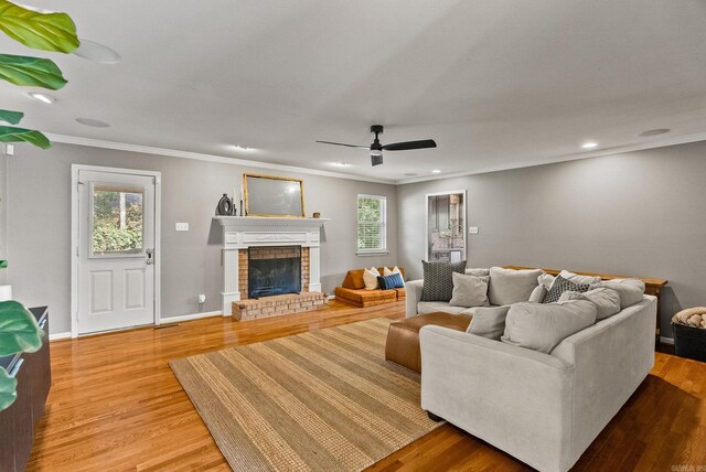 14 Cambay Ct, Little Rock, AR 72211 - living room with ceiling fan, crown molding, wood finished floors, a fireplace, and recessed lighting