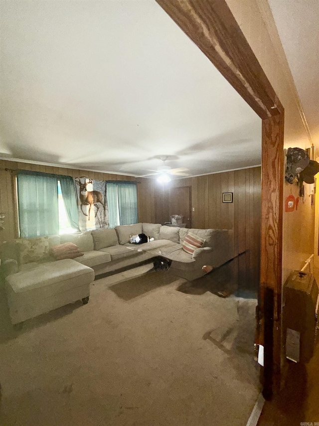 171 Sumter Dr, Malvern, AR 72104 - carpeted living area featuring wood walls and a ceiling fan