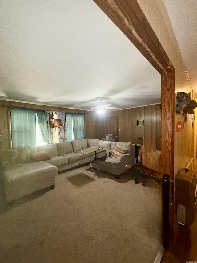 171 Sumter Dr, Malvern, AR 72104 - carpeted living room featuring wood walls and a ceiling fan