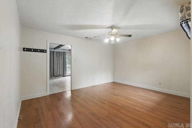 3 Kordsmeier Ct, Little Rock, AR 72205 - unfurnished room featuring a ceiling fan, wood finished floors, a textured ceiling, and baseboards