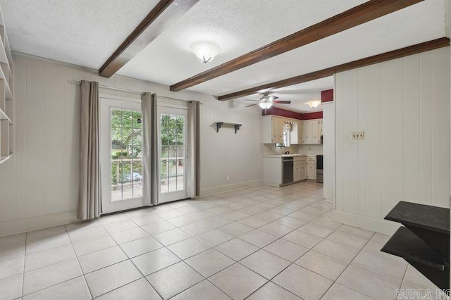 3 Kordsmeier Ct, Little Rock, AR 72205 - unfurnished living room featuring a textured ceiling, beam ceiling, baseboards, light tile patterned floors, and ceiling fan