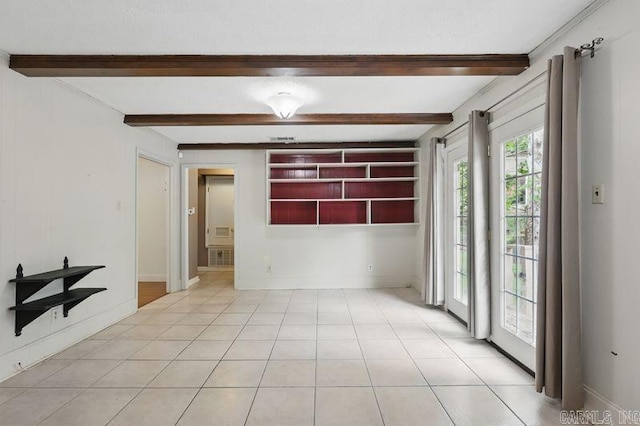 3 Kordsmeier Ct, Little Rock, AR 72205 - spare room featuring beam ceiling, baseboards, and built in features