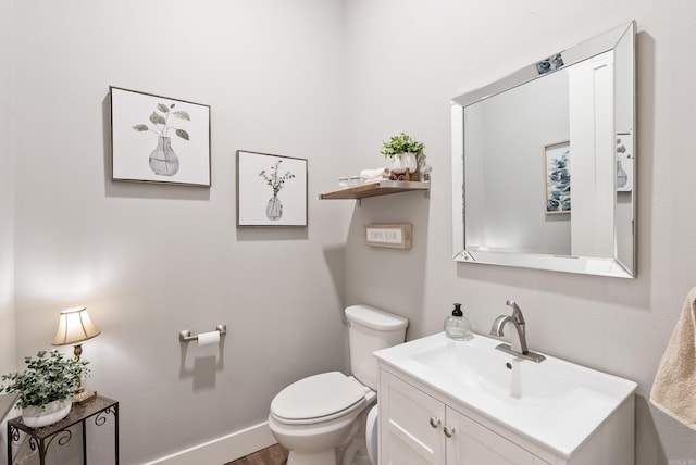 152 Clayboy Dr, Austin, AR 72007 - bathroom with toilet, vanity, and baseboards