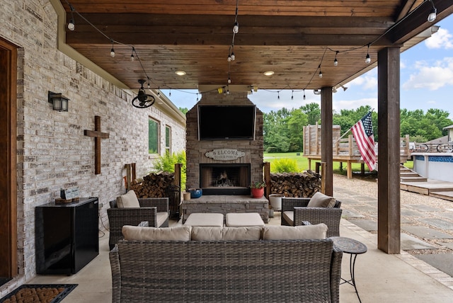 152 Clayboy Dr, Austin, AR 72007 - view of patio / terrace with an outdoor living space with a fireplace