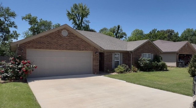 ranch-style house featuring brick siding, an attached garage, concrete driveway, and a front lawn