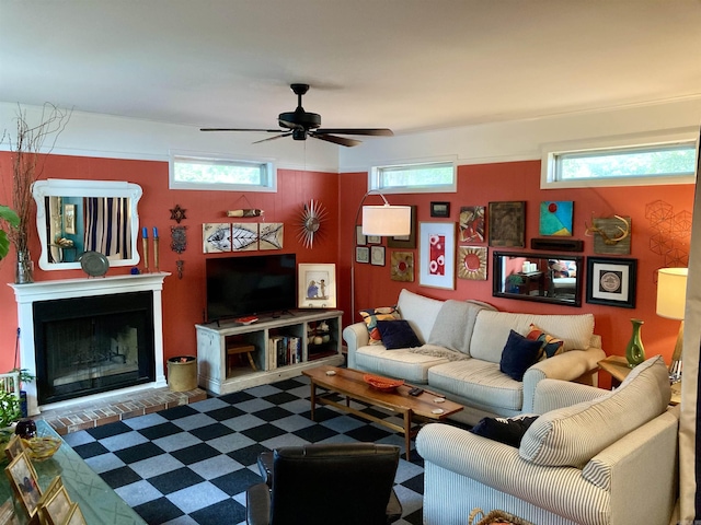 4613 Crestline Dr, North Little Rock, AR 72116 - living area with a ceiling fan, a fireplace with raised hearth, and tile patterned floors