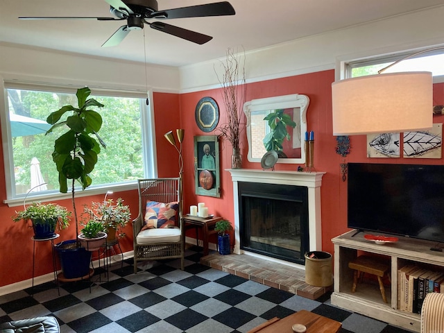 4613 Crestline Dr, North Little Rock, AR 72116 - living room with tile patterned floors, ceiling fan, plenty of natural light, and a fireplace with raised hearth