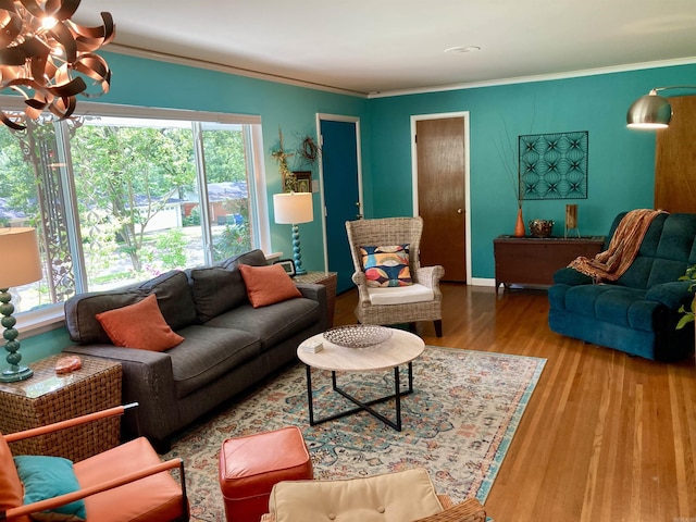4613 Crestline Dr, North Little Rock, AR 72116 - living area with plenty of natural light, a chandelier, wood finished floors, and ornamental molding