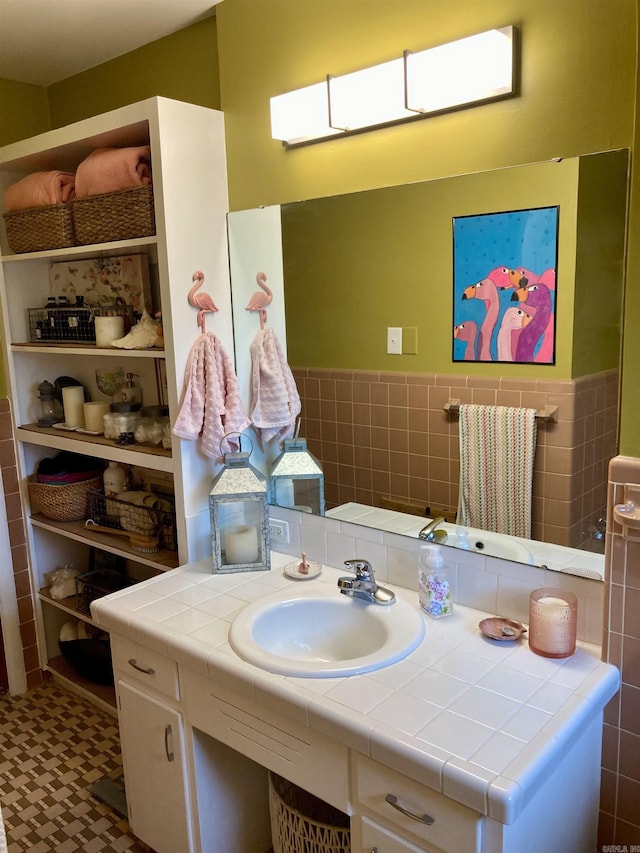 4613 Crestline Dr, North Little Rock, AR 72116 - bathroom featuring tile walls, vanity, and wainscoting