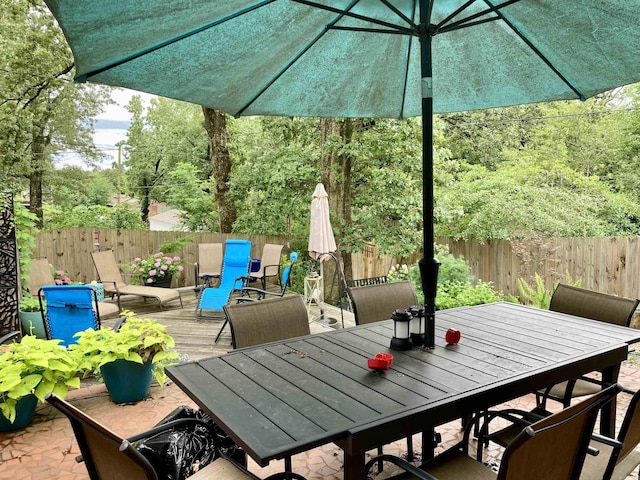 4613 Crestline Dr, North Little Rock, AR 72116 - fenced backyard featuring outdoor dining area and a deck