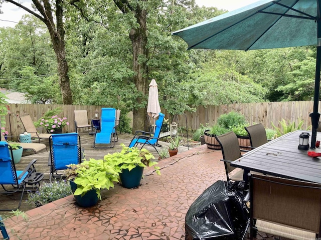 4613 Crestline Dr, North Little Rock, AR 72116 - fenced backyard with outdoor dining space, a patio area, and a deck