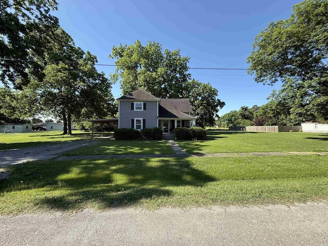 507 E Bruce St, Piggott, AR 72454 - view of front of property featuring driveway and an attached carport
