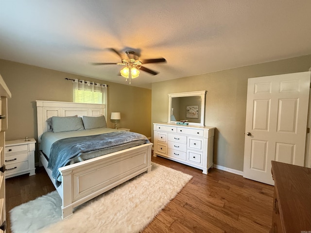 507 E Bruce St, Piggott, AR 72454 - bedroom with wood finished floors, baseboards, and a ceiling fan