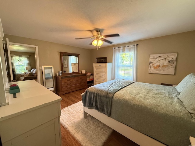 507 E Bruce St, Piggott, AR 72454 - bedroom with wood finished floors and ceiling fan