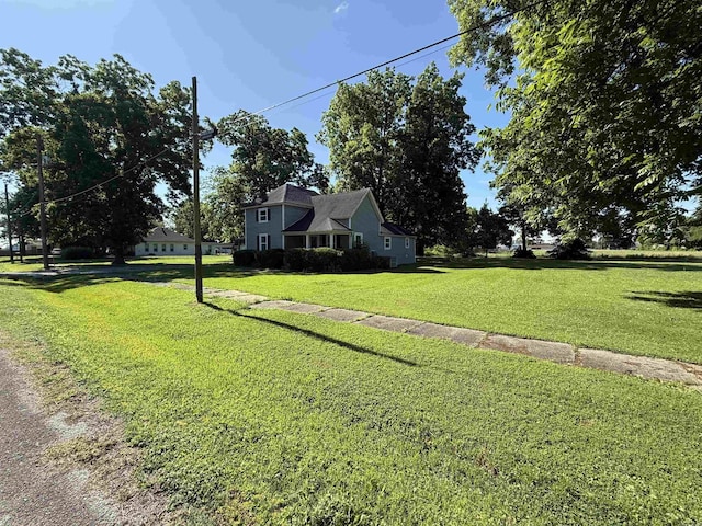 507 E Bruce St, Piggott, AR 72454 - view of front of property with a front yard