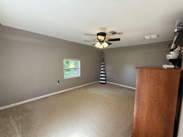 507 E Bruce St, Piggott, AR 72454 - unfurnished room with light carpet, ceiling fan, and baseboards