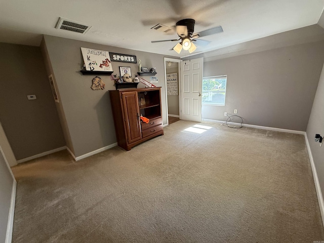 507 E Bruce St, Piggott, AR 72454 - living area with a ceiling fan, light colored carpet, and baseboards