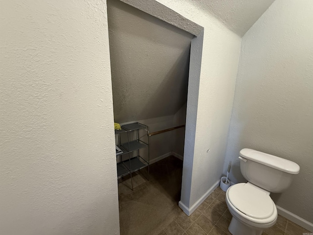 507 E Bruce St, Piggott, AR 72454 - bathroom featuring toilet and baseboards