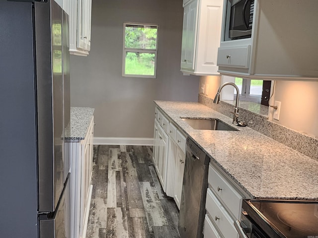 211 Burnt Rock Falls Rd, Fairfield Bay, AR 72088 - kitchen featuring appliances with stainless steel finishes, a sink, white cabinetry, and dark wood finished floors