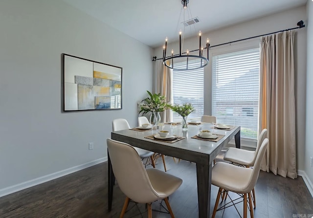 5045 Maple Leaf Dr, Benton, AR 72019 - dining area featuring dark wood-style flooring, a chandelier, and baseboards