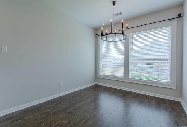 5045 Maple Leaf Dr, Benton, AR 72019 - spare room featuring a chandelier, baseboards, and dark wood finished floors
