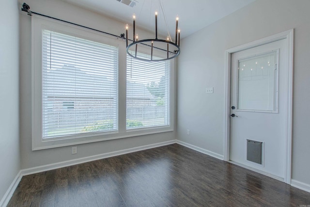5045 Maple Leaf Dr, Benton, AR 72019 - unfurnished dining area with a chandelier, dark wood-style flooring, and baseboards