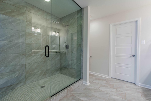 5045 Maple Leaf Dr, Benton, AR 72019 - bathroom featuring a shower stall, baseboards, and tile patterned flooring