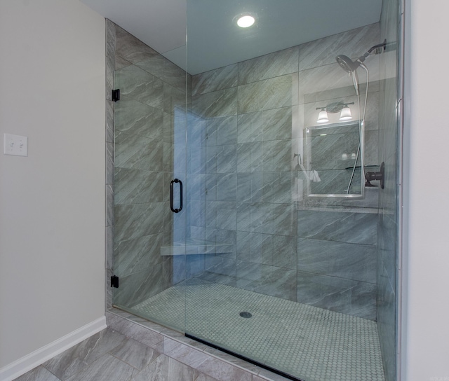 5045 Maple Leaf Dr, Benton, AR 72019 - bathroom with baseboards, a stall shower, marble look tiles, and recessed lighting