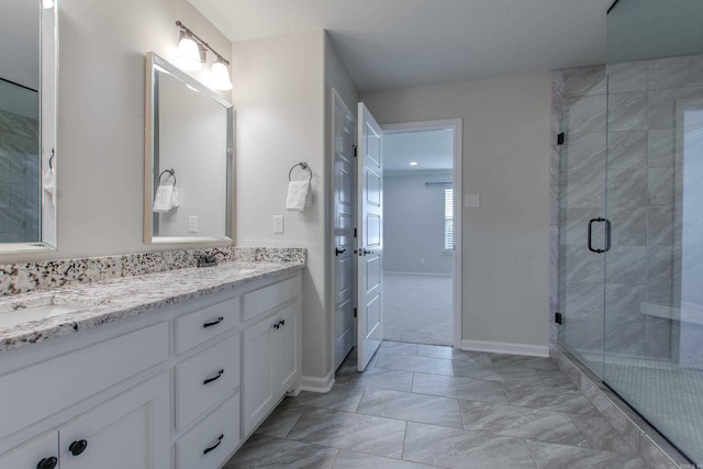 5045 Maple Leaf Dr, Benton, AR 72019 - full bathroom featuring double vanity, a stall shower, and baseboards