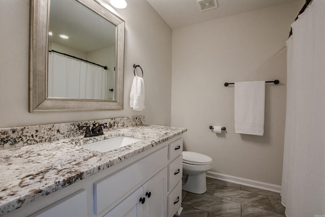 5045 Maple Leaf Dr, Benton, AR 72019 - full bath with baseboards, vanity, marble look tiles, and toilet