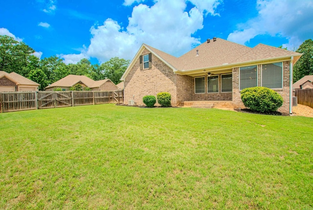 5045 Maple Leaf Dr, Benton, AR 72019 - rear view of house featuring brick siding, a ceiling fan, and roof with shingles
