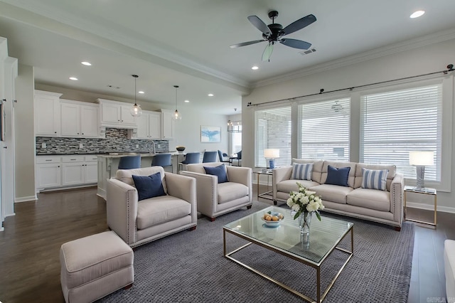 5045 Maple Leaf Dr, Benton, AR 72019 - living area with dark wood finished floors, ceiling fan, ornamental molding, recessed lighting, and baseboards