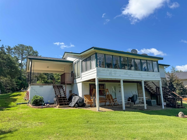 87 Wyandotte Dr, Cherokee Village, AR 72529 - rear view of property with stairs, a sunroom, a yard, and a patio