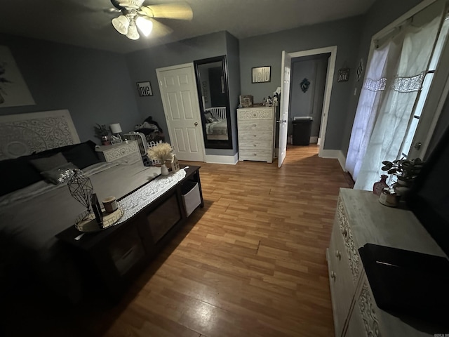 621 W 7th St, Rector, AR 72461 - living room featuring wood finished floors, ceiling fan, and baseboards