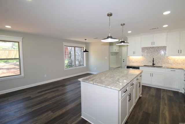 308 N Arch St, Sheridan, AR 72150 - kitchen with a sink, baseboards, dark wood-type flooring, tasteful backsplash, and recessed lighting
