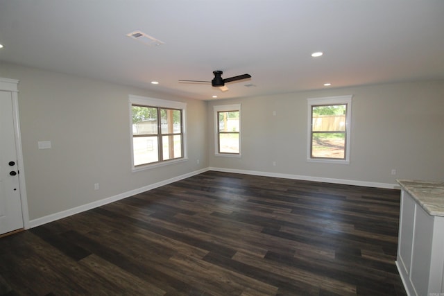 308 N Arch St, Sheridan, AR 72150 - empty room with a ceiling fan, dark wood finished floors, recessed lighting, and baseboards