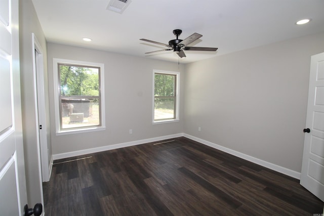 308 N Arch St, Sheridan, AR 72150 - empty room featuring healthy amount of natural light, ceiling fan, dark wood-style floors, recessed lighting, and baseboards