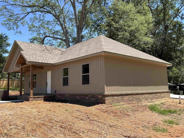 308 N Arch St, Sheridan, AR 72150 - view of front of home featuring a shingled roof, a porch, and brick siding