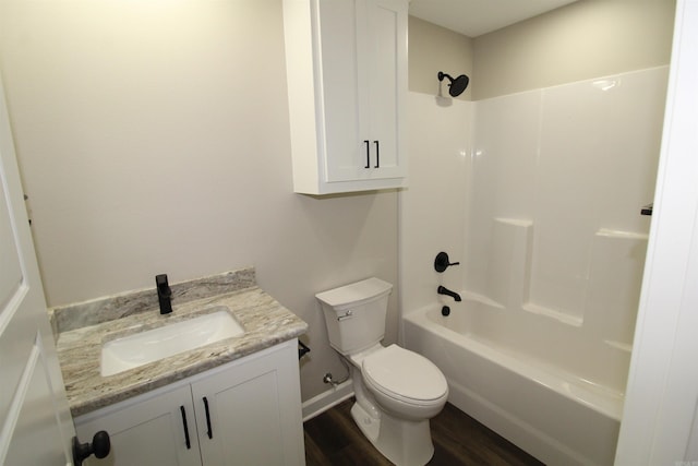 308 N Arch St, Sheridan, AR 72150 - full bath with toilet, wood finished floors, vanity, and tub / shower combination