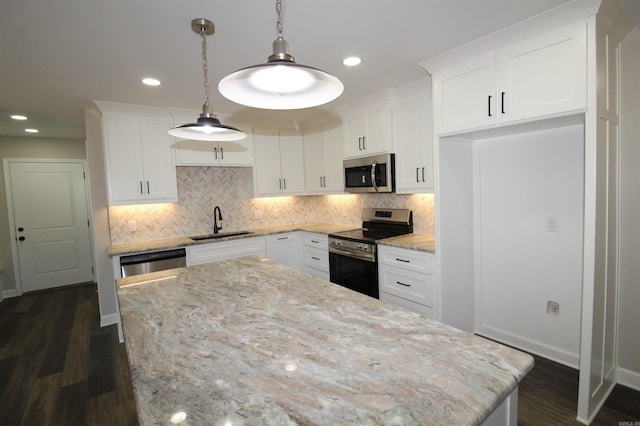 308 N Arch St, Sheridan, AR 72150 - kitchen featuring appliances with stainless steel finishes, a sink, white cabinetry, tasteful backsplash, and recessed lighting
