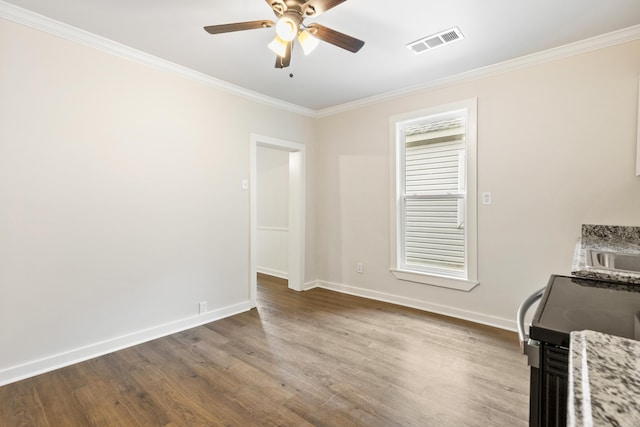 2506 W 6th St, Little Rock, AR 72205 - unfurnished room with ceiling fan, crown molding, wood finished floors, and baseboards