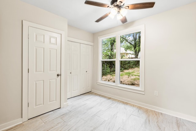 2506 W 6th St, Little Rock, AR 72205 - unfurnished bedroom with baseboards, a closet, and a ceiling fan