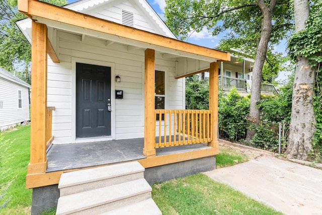 2506 W 6th St, Little Rock, AR 72205 - view of exterior entry featuring a yard and a porch