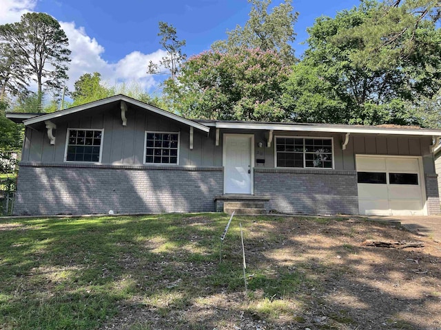 20 Glendale Dr, Little Rock, AR 72209 - ranch-style house with brick siding, board and batten siding, an attached garage, and a front lawn