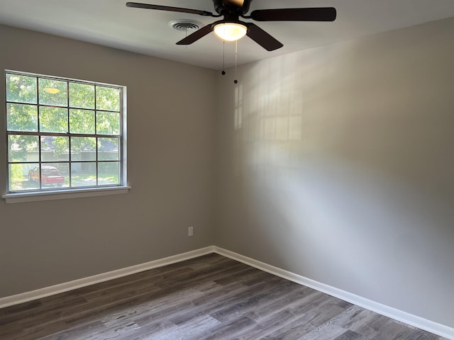 20 Glendale Dr, Little Rock, AR 72209 - empty room featuring dark wood-style floors, a ceiling fan, and baseboards